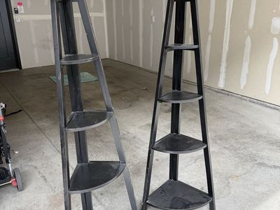 2 black corner shelves