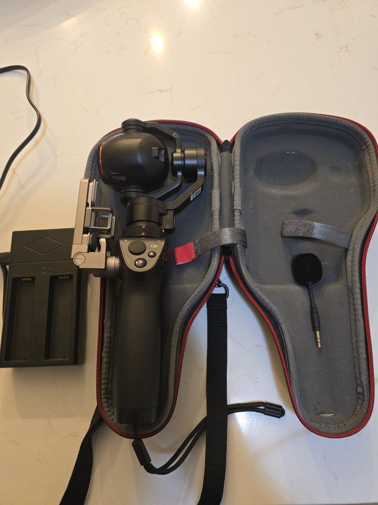 DJI Osmo Handheld Gimbal with a Zenmuse X3 Camera, featuring a 4K camera mounted on a 3-axis stabil