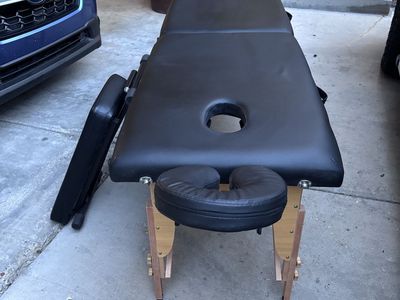 Portable Black Massage Table with Adjustable Headrest and Side Armrests