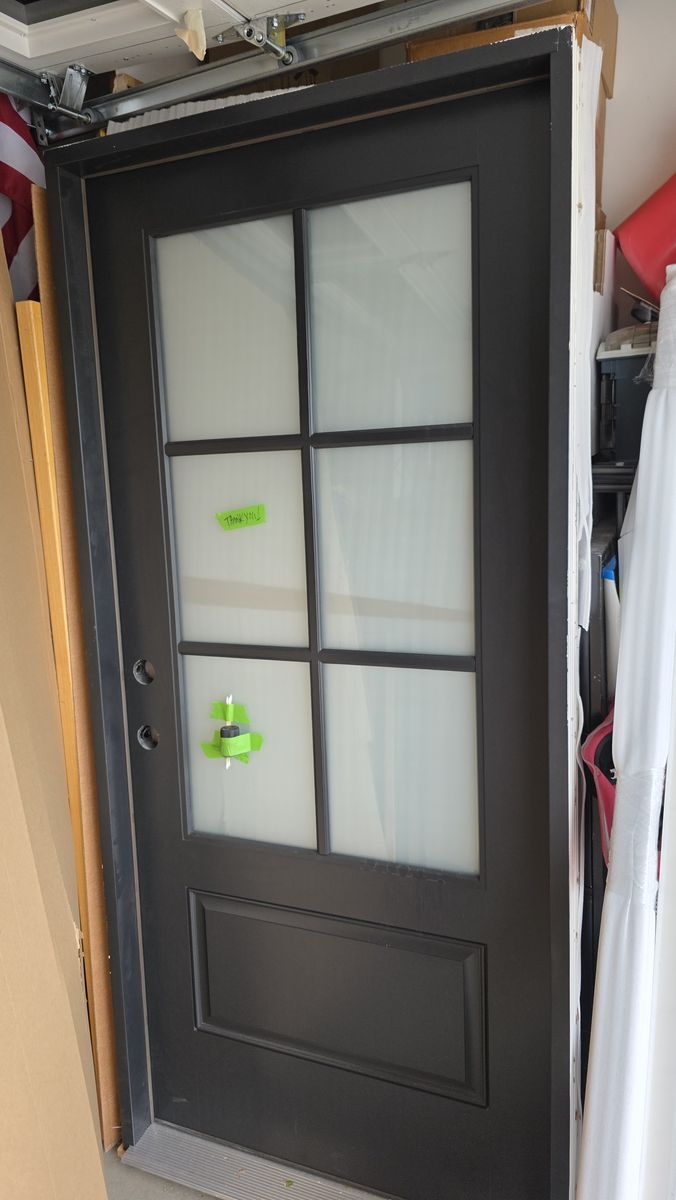 New front door beautiful black! Privacy glass, back, patio, garage door. Exterior interior