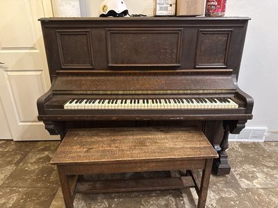 Antique New England upright piano with bench