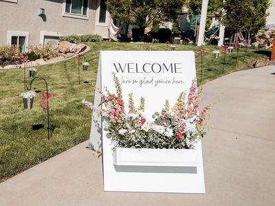Welcome sign with floral box