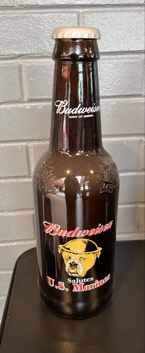 Vintage decorative Budweiser U.S marines salutes amber bottle.