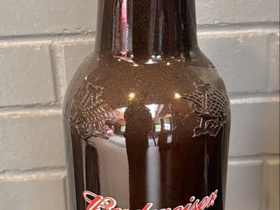 Vintage decorative Budweiser U.S marines salutes amber bottle.