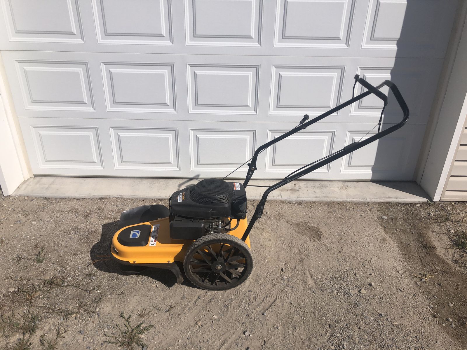 Walk behind weed trimmer
