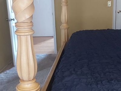 King-size poster bed heavy wood