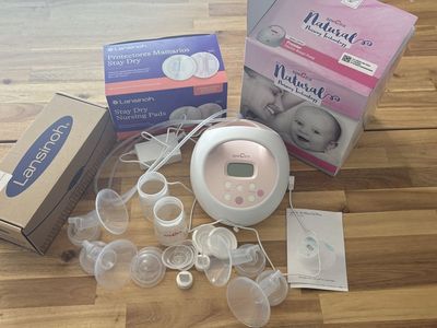 Spectra Breast Pump. Accessories, milk, storage bags, and breast pads.