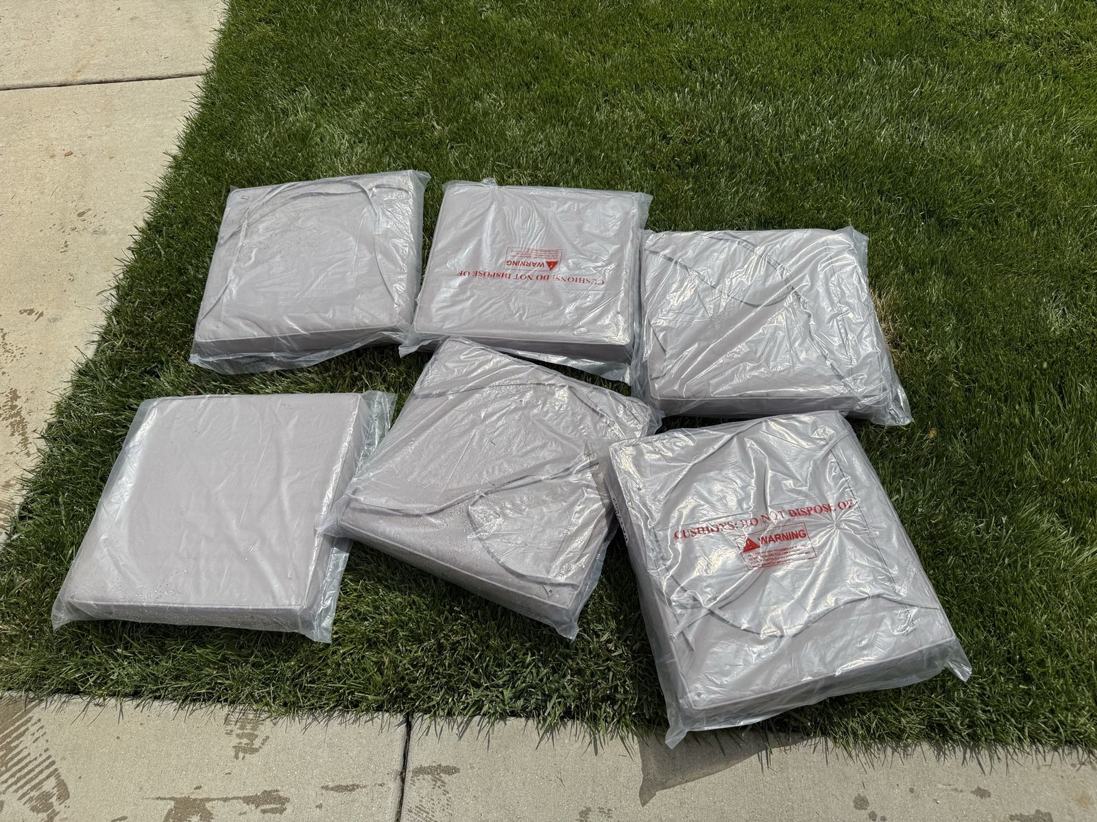NEW sealed and in package tan outdoor chair cushions (6) zipper off for washing! 15 X 15