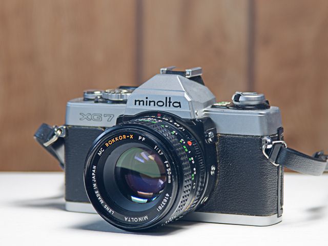 Minolta XG-7 w/Minolta 50mm f?1.7 MC Rokkor-X PF Lens. 55mm Filter Thread, No Cap, Thin Plastic Strap.