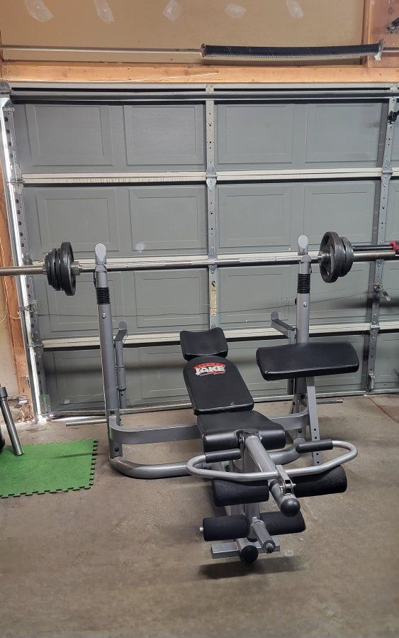 Bench and 100 pounds of weighst