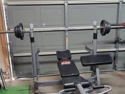 Bench and 100 pounds of weighst