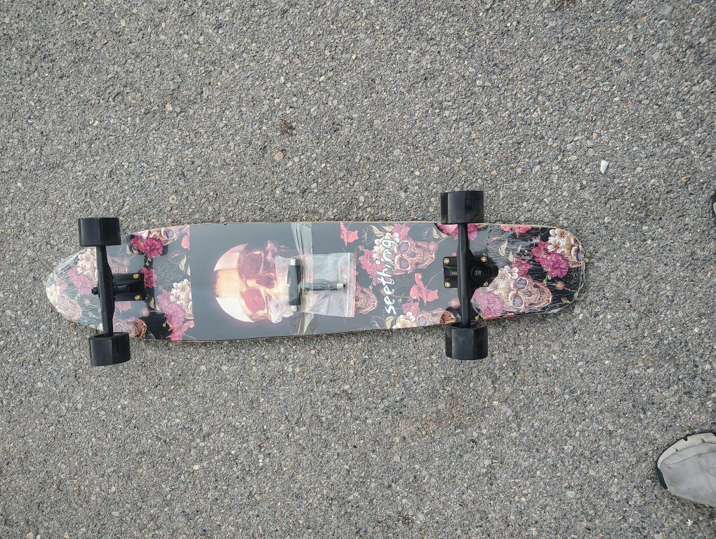 Seething brand drop-through longboard with a flora