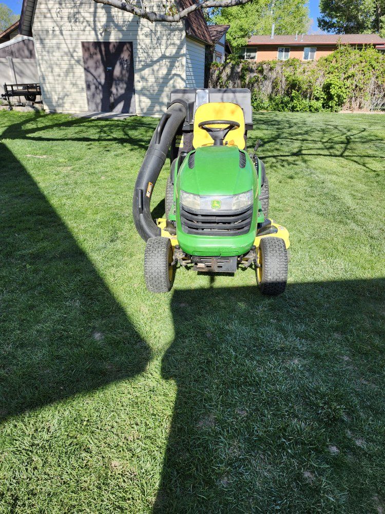 John Deere, riding lawn mower.