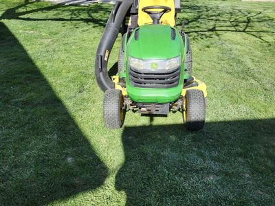 John Deere, riding lawn mower.