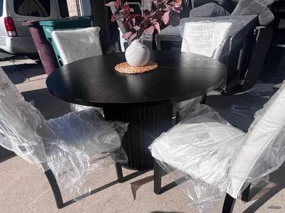 Round Black Pedestal Dining Table with 4 White Tufted Chairs