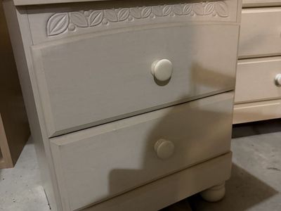 White Wooden Dresser and Nightstand Set with Carved Leaf Detail