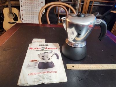 Bialetti Mokka Coffee Maker and cappacinno pot. Makes espresso on the stove. Works great, perfect shape.