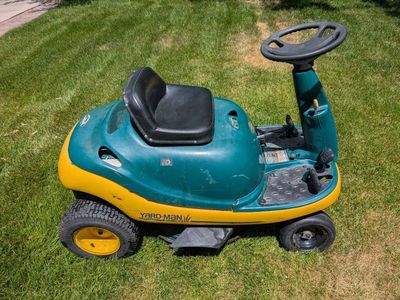 Yard-Man Ride-On Lawn Mower - Compact and Functional