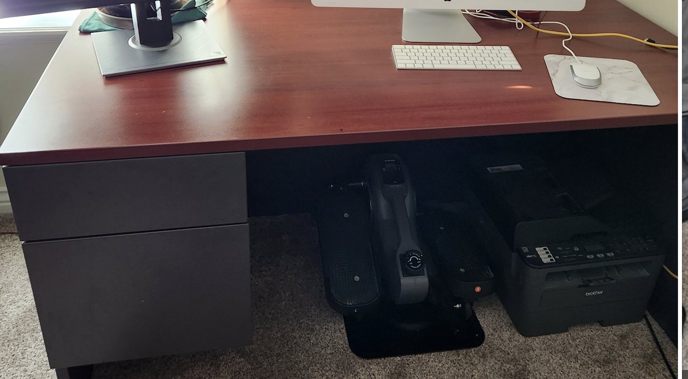 Desk, office chair, monitor, keyboard and speaker