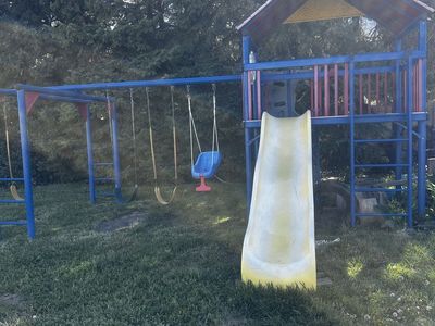 Massive commercial grade play set with monkey bars and slide
