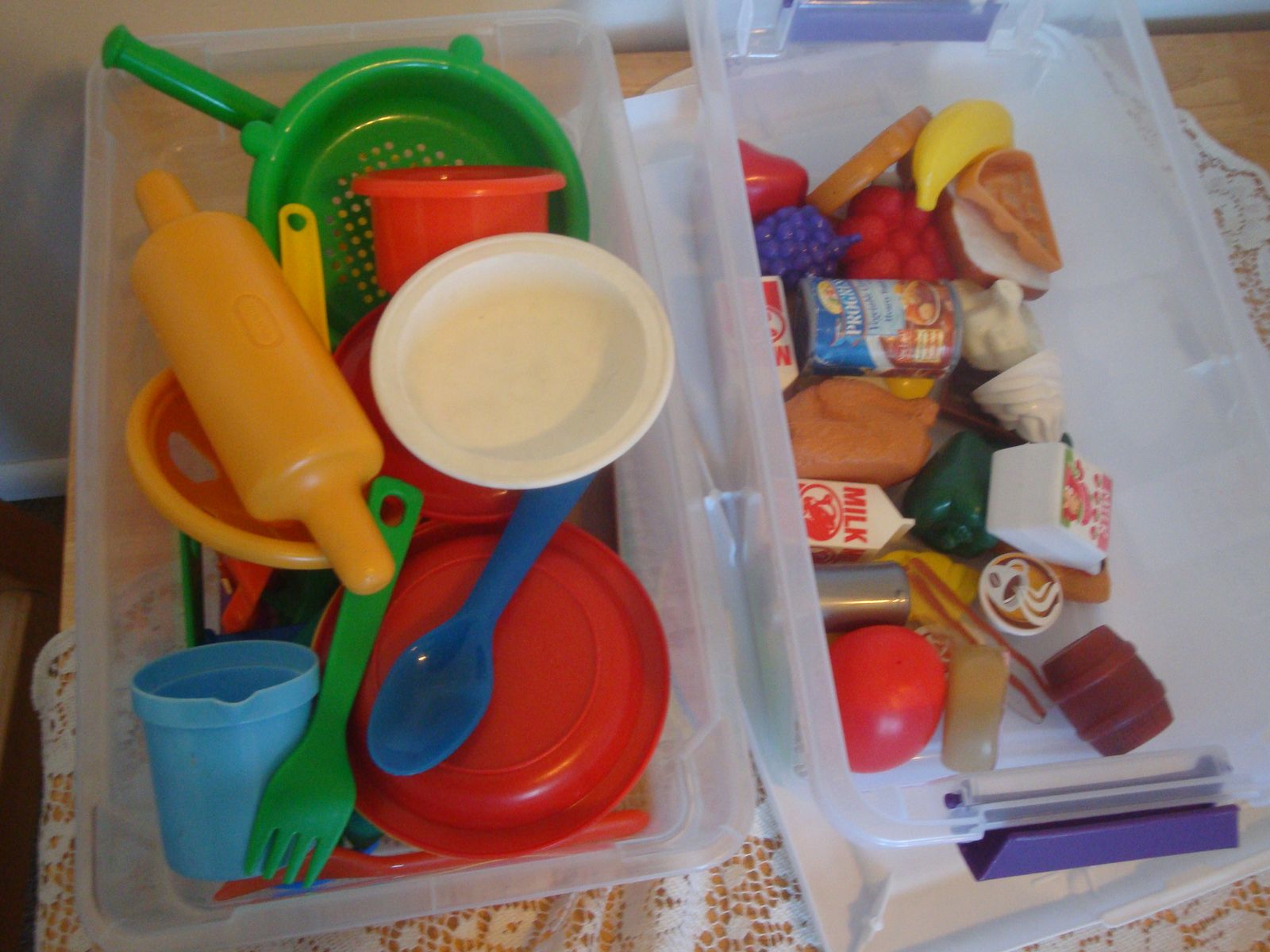 toy kitchen cabinet, dishes, and food