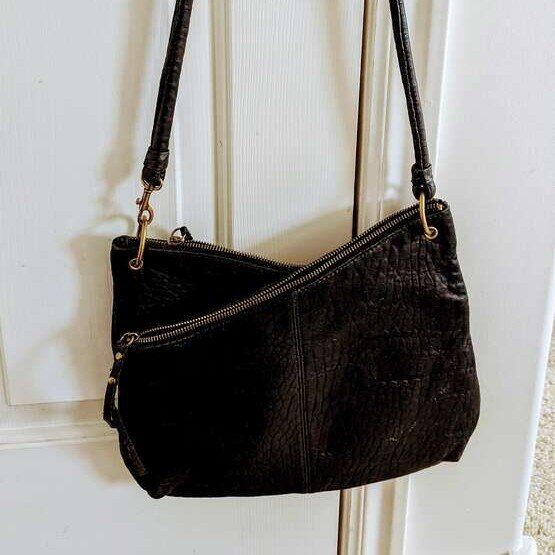 Shoulder/crossbody handbag with two angled zippers