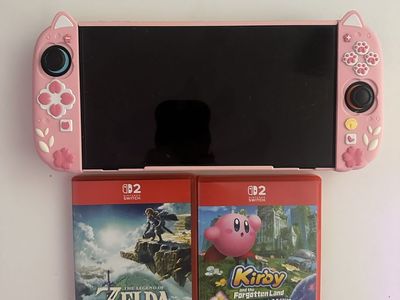 Pink Nintendo Switch 2 with Zelda: Tears of the and Kingdom & Kirby and the Forgotten Land. Call or text, I don’t bite.