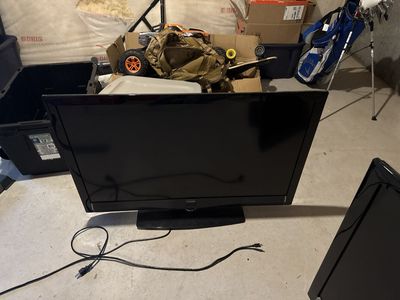 Black Flat Screen Television with Stand
