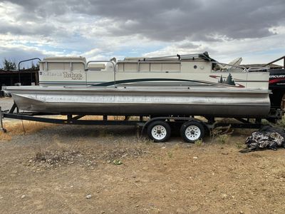 Tahoe Pontoon Boat with Mercury FourStroke Outboard and Trailer - Good Condition, Ready for the Water