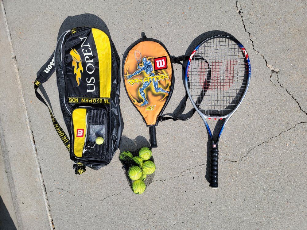 US open racket bag with 2 rackets.