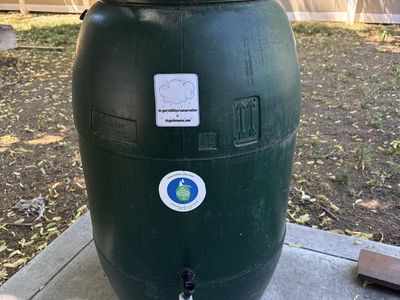 Oatey Dark Green Rain Barrel with Spigot - Water Conservation for Your Garden