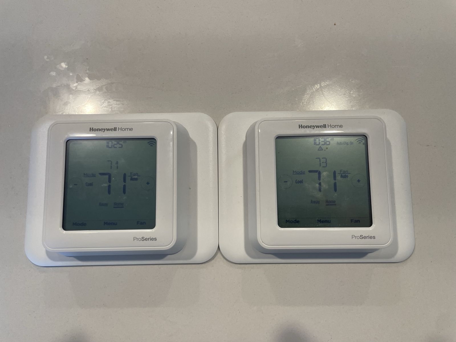 Two Honeywell Home ProSeries Smart Thermostats