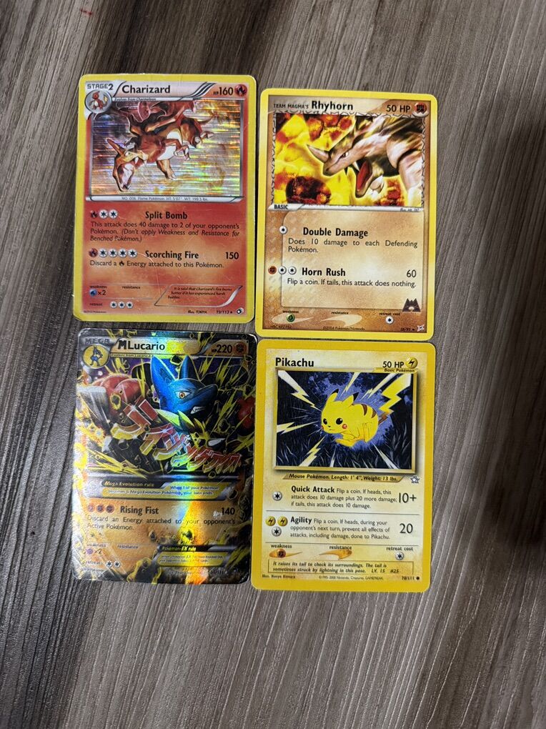 Pikachu, Charzard & two More Pokemon Cards