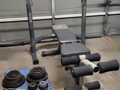 Bench and 210 pounds of weights