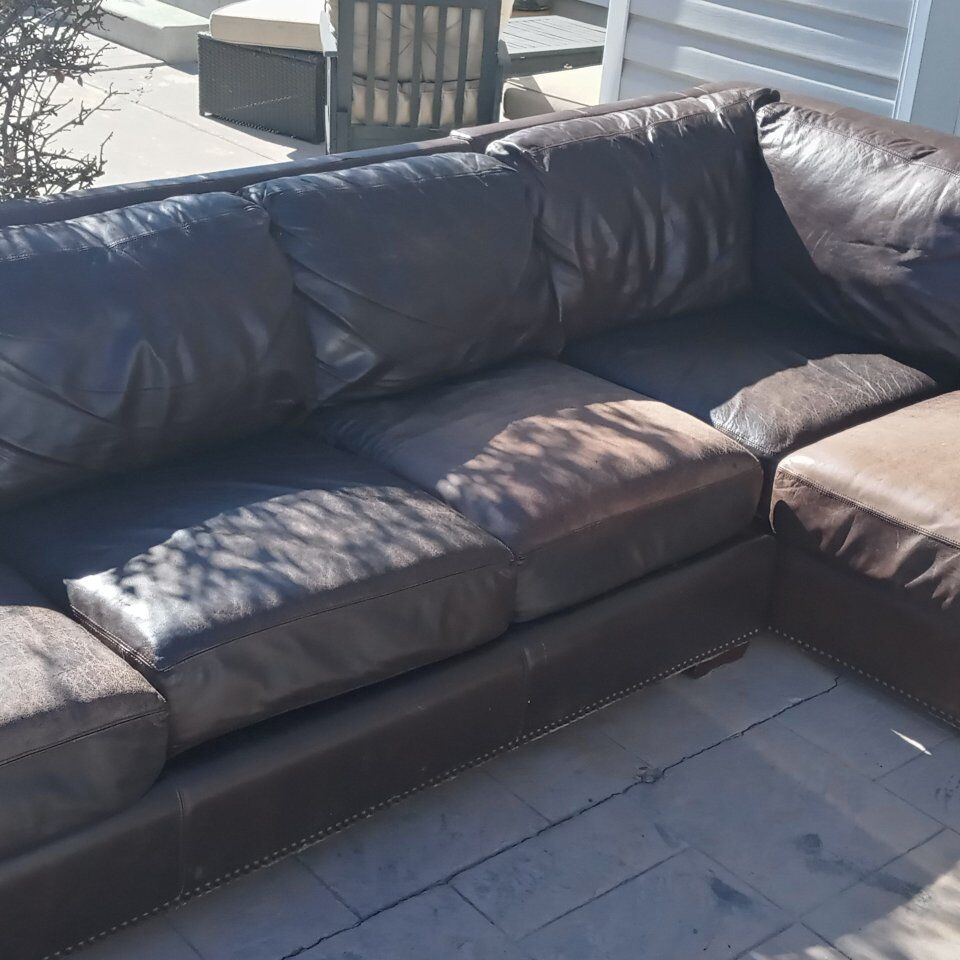nice two piece leather couch/lounge/sectional