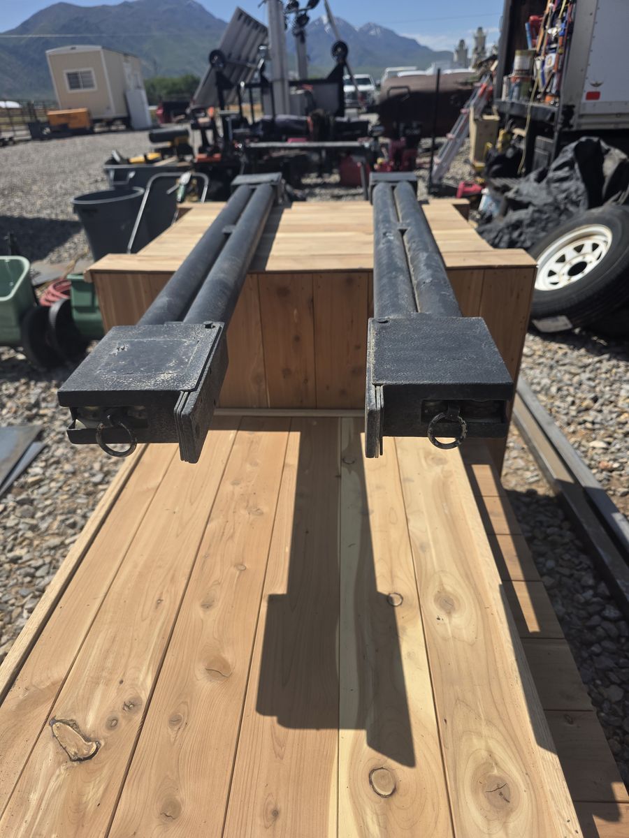 Double barrel trailer ramp spring assist