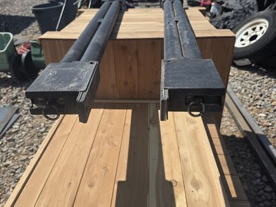 Double barrel trailer ramp spring assist