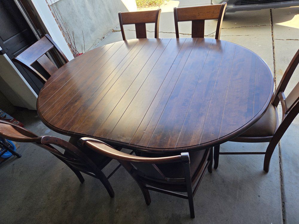 nicholes and stone round table with leaf and 6 cha