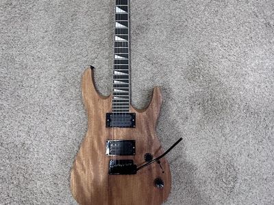 Jackson Electric Guitar - Brown, 6-String, Tremolo Bar, Pointed Headstone -Natural Color