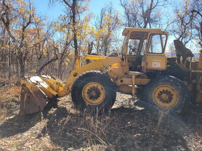 Backhoe, 4 wheel drive, clam-shell front loader, glassed in cab - $19,500 (provo)