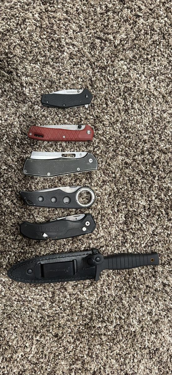 Assorted Pocket Knives Lot featuring Kershaw, Gerber, and Smith & Wesson