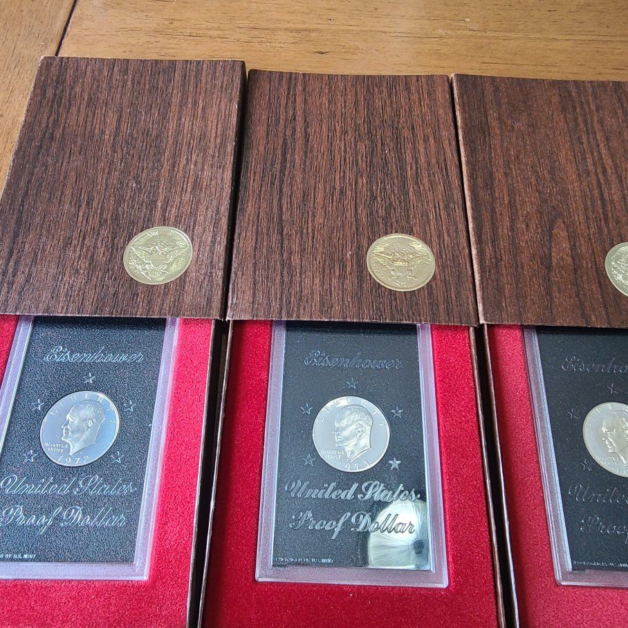 3 Ike brown box proof coins in factory boxes .