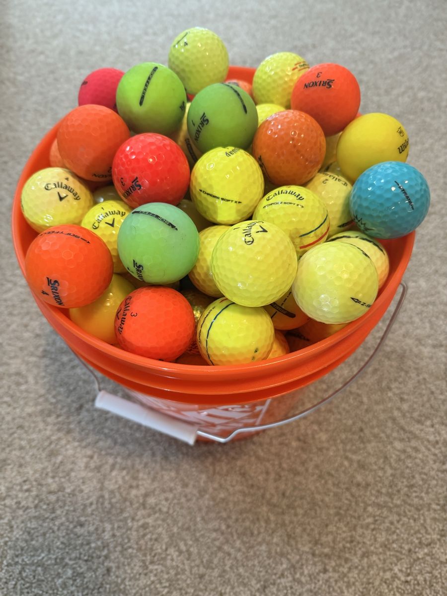 125 colored golf balls in new bucket