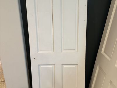 Quality solid wood interior doors removed during a remodel. These are not hollow-core or MDF—they are solid wood construction.