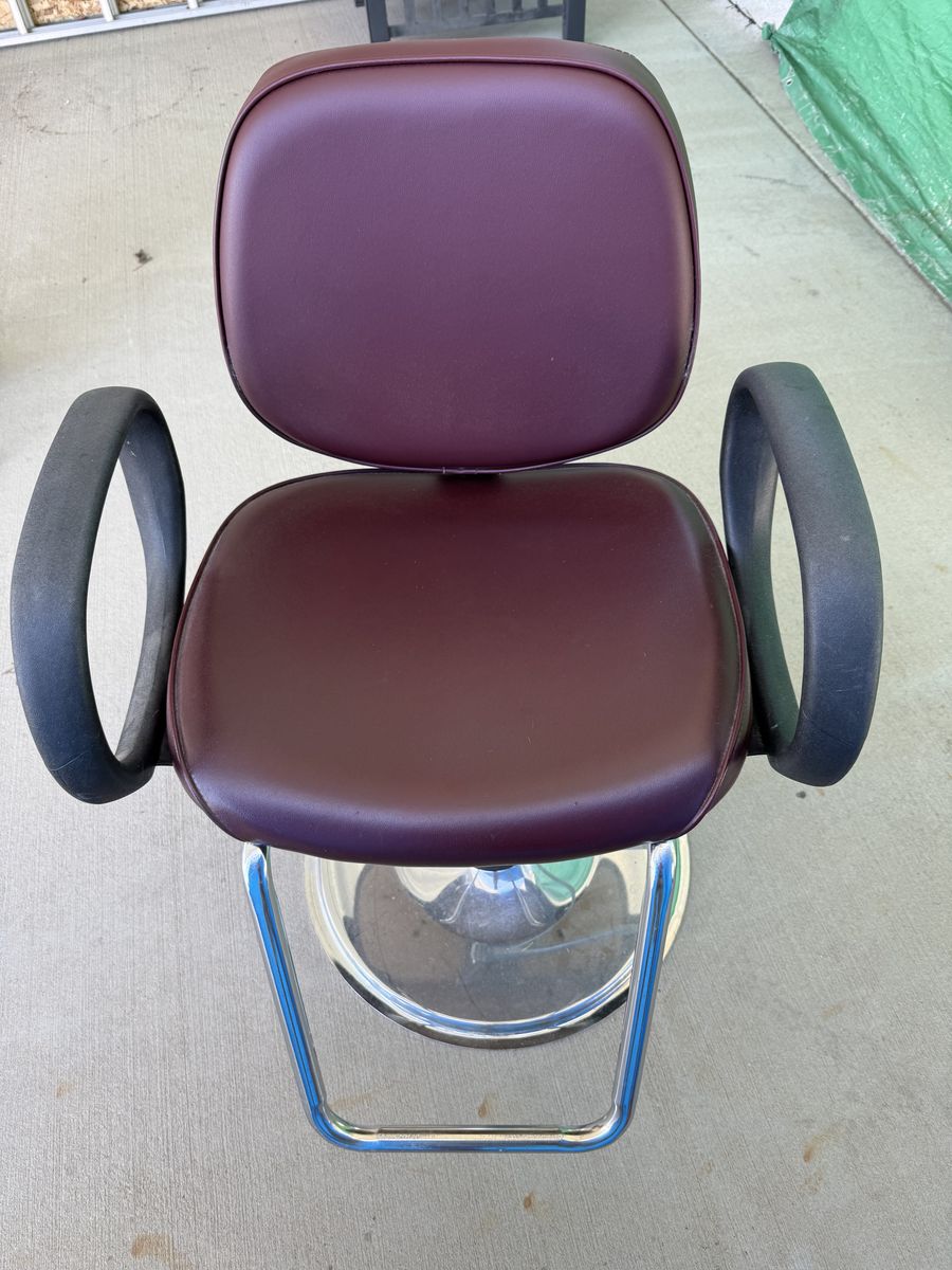 Barber Hydraulic chair and professional hooded hair dryer.