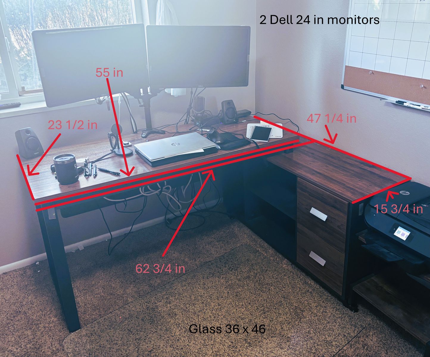 Desk with 2 monitors and glass floor protector