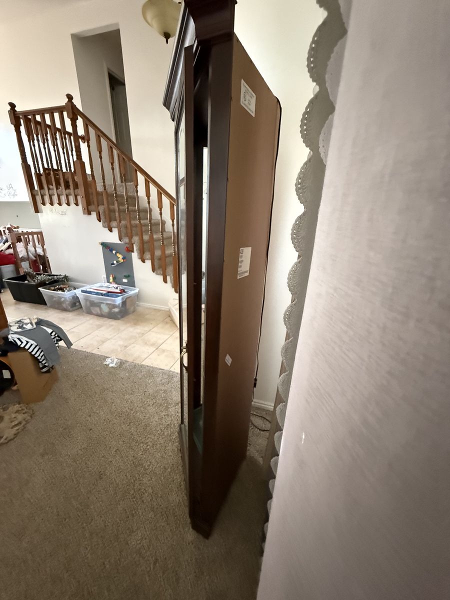 Tall corner cabinet (fits into a room corner)