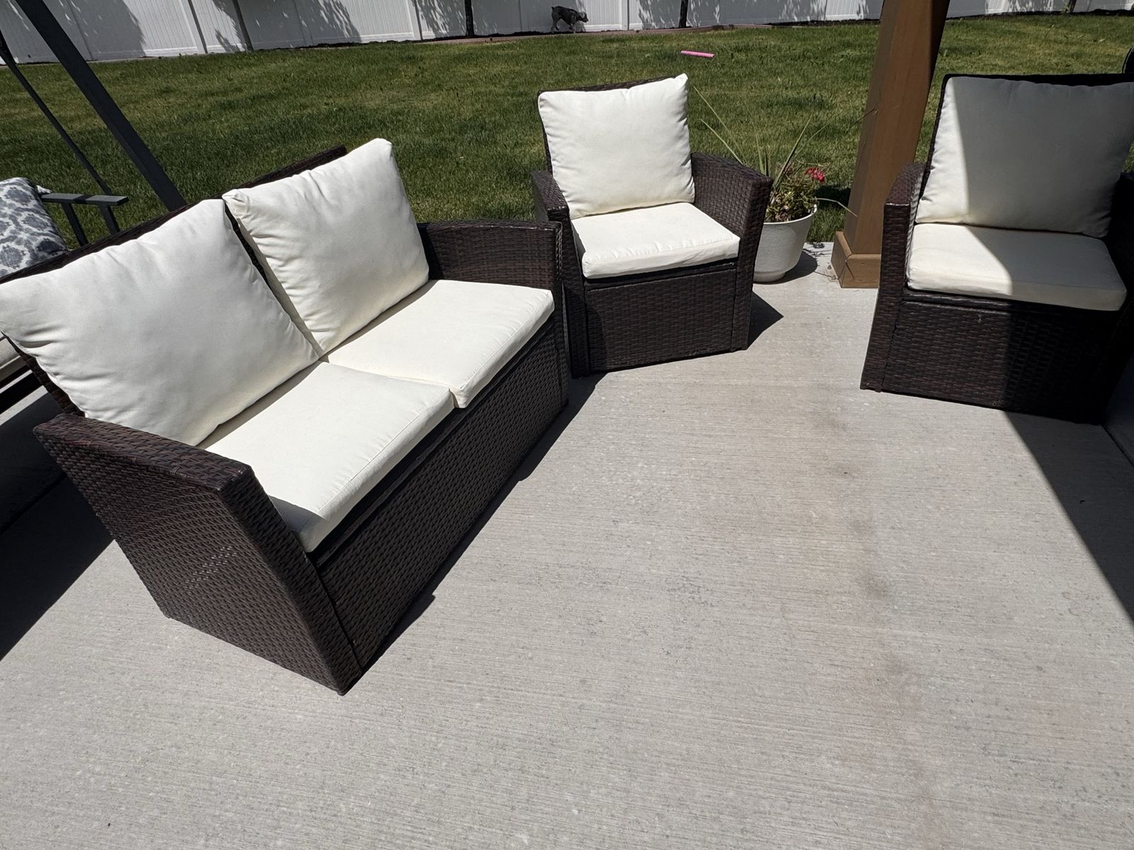 Outdoor Wicker Patio Furniture Set - Loveseat & 2 Armchairs with Cream Cushions.