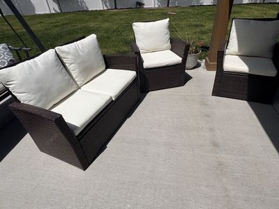 Outdoor Wicker Patio Furniture Set - Loveseat & 2 Armchairs with Cream Cushions.