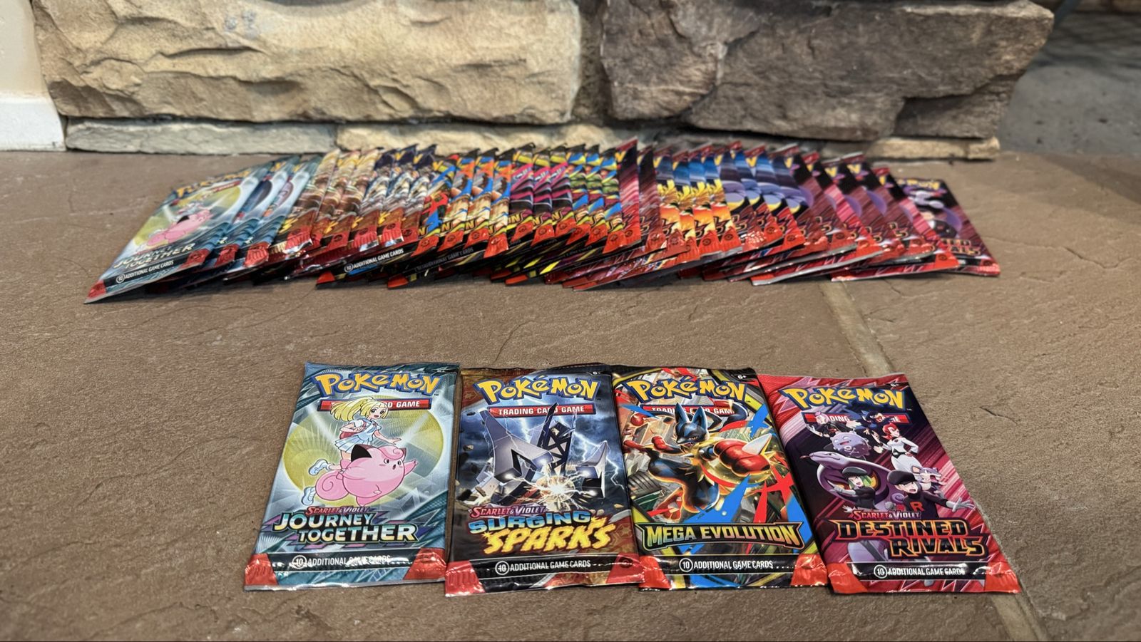 Various Pokémon Card TCG packs (see pictures) Pokemon destined rivals surging sparks mega evolutions and journey together